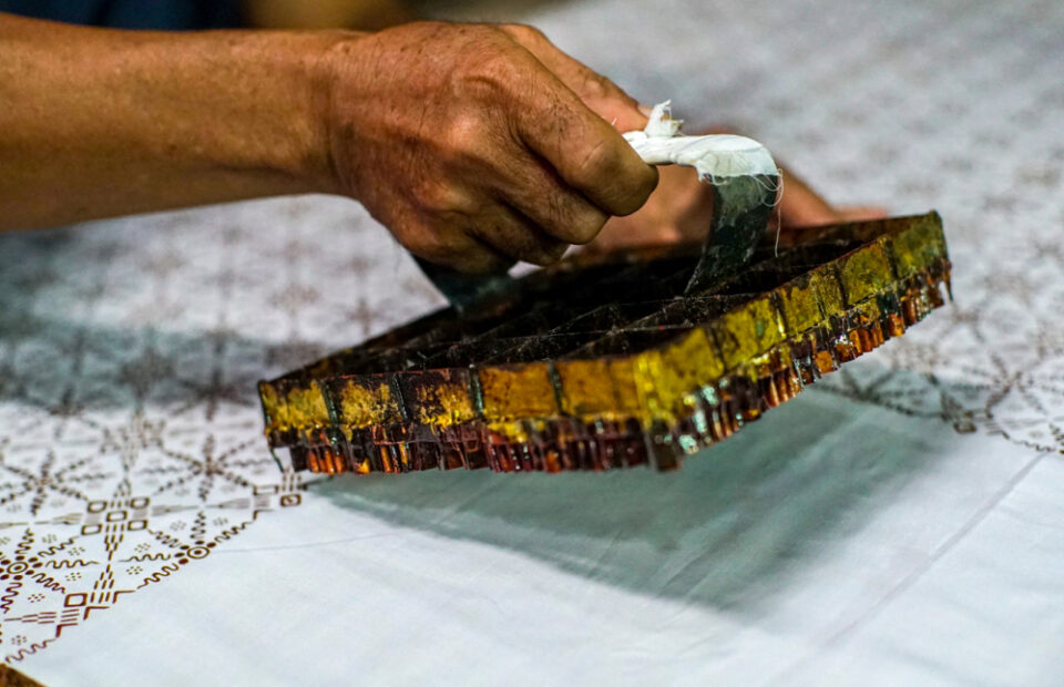 Using a tjap for stamping out a pattern